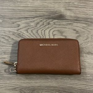 Michael Kors zip wallet with wrist strap brown.